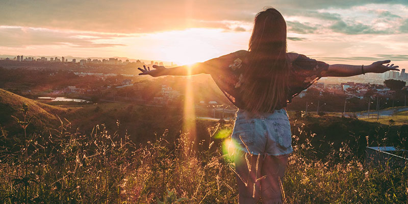 Woman watching the sun